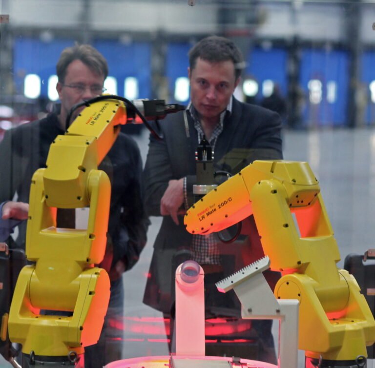 Industrial robotic arm performing assembly work on a production line